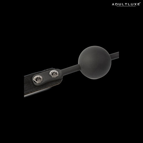 SEI MIO Strictly Come Quietly ball gag - close-up of matte silicone ball and branded metal snap fasteners